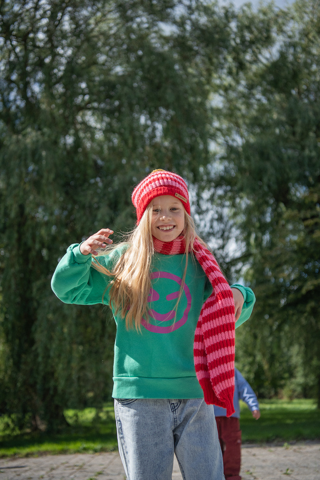 Piupiuchick knitted hat with pompon RED AND PINK STRIPES