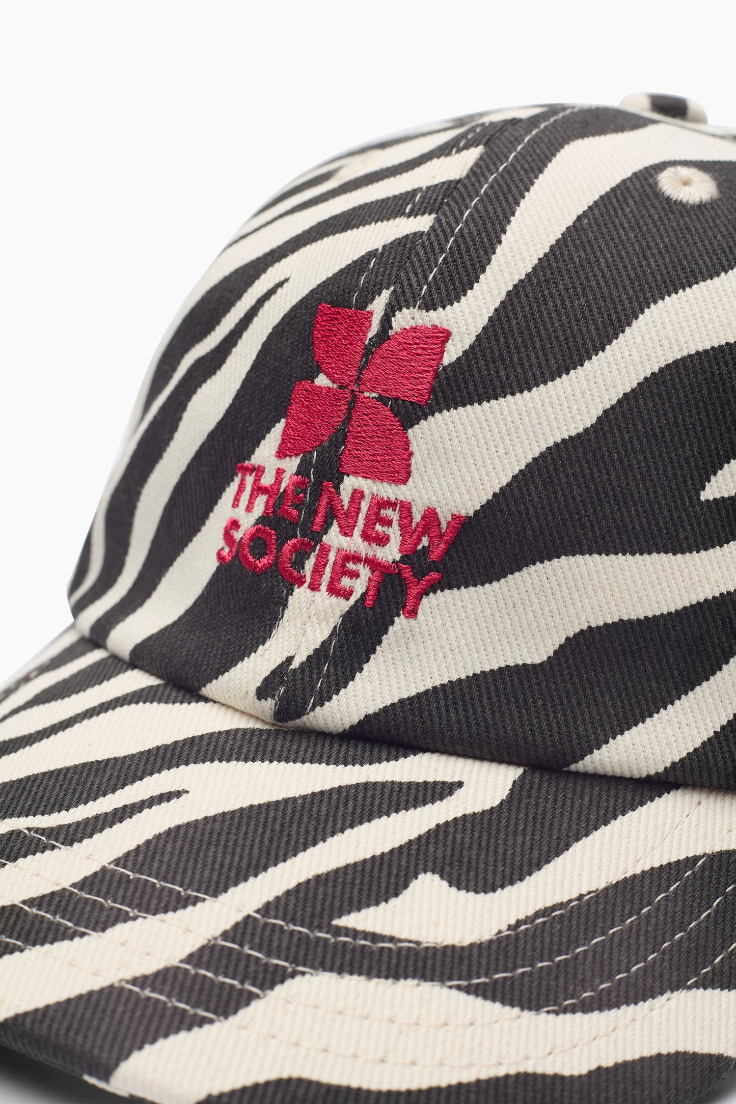 The New Society TNS Logo cap zebra print