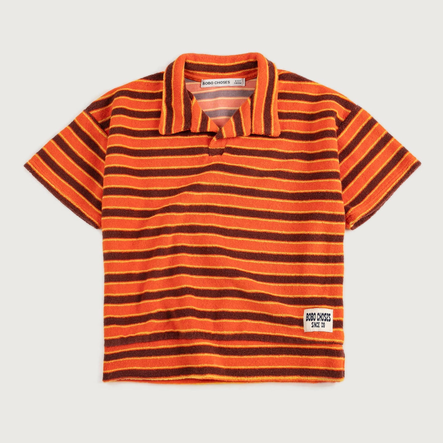 Gestreepte polo in badstof oranje bruin geel Bobo Choses